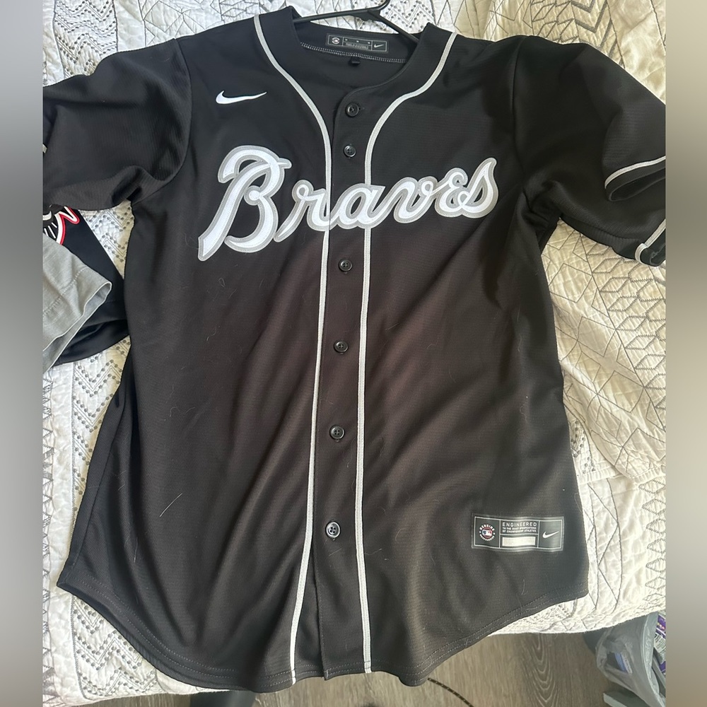 Black Braves baseball jersey , size medium , used like new